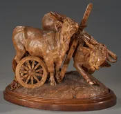 A powerful, technically accomplished sculptural group depicting two yoked oxen straining in harness — Daniels Antiques