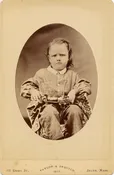 KID HOLDING PULL TOY.