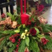 holiday greens centerpiece with candle