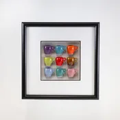 10x10 Shadow Box with a Purple Mug and Pink Mug in a Black Frame