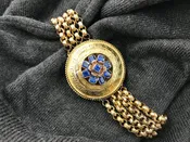 Antique Victorian Etruscan Revival 19K yellow gold round medallion bracelet set with Burmese sapphire caplets