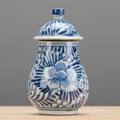 A Pair of Lidded Jars Rolling Petals