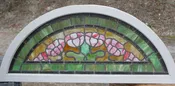 Antique arched stained glass window.