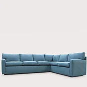 Bespoke Cushion Back L Shape Sofa with Upholstered Plinth and Square Arms in blue Pierre Frey fabric