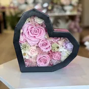 Beautiful preserved flowers and necklace in heart box