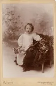 Baby Holding ABC Book Standing Next to Huge Cat, New York City Cabinet Card