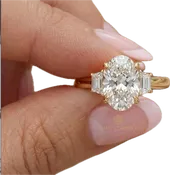 Custom Oval Three Stone Engagement Ring with Trapezoid Side Diamonds in 18K Yellow Gold
