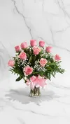12 light pink roses in vase
