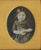HOLDING UP A LOCKET?