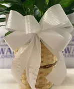 Add on a handmade white bow to enhance your arrangement.