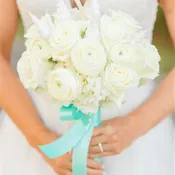 Hydrangea, roses, ranunculus, sea shells, and starfish.