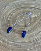 E124 Lapis Earrings — Lilly Barrack  Seasoned artist, Lilly Barrack, has been designing hand-made sterling silver gemstone jewelry for more than three decades. The Lilly Barrack’s three store locations (two in Albuquerque, NM, and one in Scottsdale, AZ.) carry exclusive gift items and designs from upwards of 60 unique artists.
