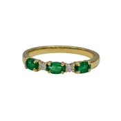 0.63 Carat Oval Emerald and 0.09 Carat Round Diamond Ring in 18K Yellow Gold