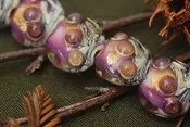 10108912 - Four Cranberry Treasure Lentil Beads