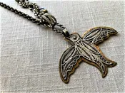 115 Antique Sterling Filigree Bird mounted on bronze backplate on mixed antique, vintage and reclaimed chain mix