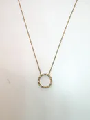 10K,Yellow gold, .10 diamond total weight, open circle pendant.
