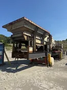 (2004) INERTIA 5066 IMPACT CRUSHER W/ VGF, UNDERCONVEYOR, 300HP MOTOR & NEW SOFT START ON 3-AXLE CHASSIS