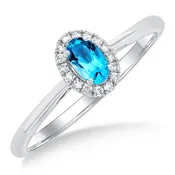 10Kt White Gold 5x3mm Oval Blue Topaz & 0.07cttw Diamond Halo Ring