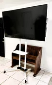 65 inch TV with Rolling Stand — Seven Paths Manor
