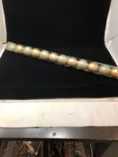 12 GOLD SPARKLE ORNAMENTS IN TUBE.