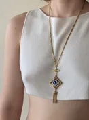 Gold toned intricate pendant necklace