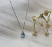 10K White Gold Blue Topaz & Diamond Halo Pendant