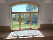 H1 Master Bath - Andersen Wood Casement Window, 62 x 72, Arched Transom, 3-Lite