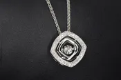 14 Karat White Gold “Dancing” Diamond pendant