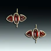 “Above Suspicion” 18k and garnet earrings
