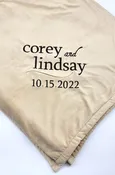 Wedding blanket with swirl design and bride and groom
