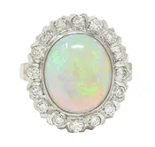 1940's Opal Diamond 14 Karat Two-Tone Gold Vintage Halo Ring