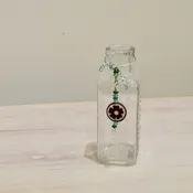Vintage Hire’s Extract Jar Decorated with Flower Charm