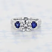 1.20 Ct. Round Shape Moissanite Engraved Three-Stone Platinum Engagement Ring (2006326)