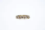 Alternating baguette and round diamond band
