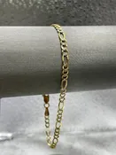 10 Karat Two-Tone Yellow and White Gold Beveled Figaro Bracelet