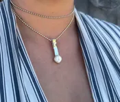 N104 Mother of Pearl Necklace — Lilly Barrack  Seasoned artist, Lilly Barrack, has been designing hand-made sterling silver gemstone jewelry for more than three decades. The Lilly Barrack’s three store locations (two in Albuquerque, NM, and one in Scottsdale, AZ.) carry exclusive gift items and designs from upwards of 60 unique artists.
