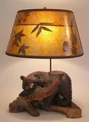 Ainu antique carved bear with big fish lamp with mica lamp shade with natural leaves