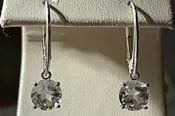 0.90cttw Mason County Clear Topaz Lone Star Cut Mounted in a Sterling Silver dangle lever back earrings.