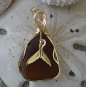 Brown Sea Glass Pendant Wrapped in Gold with Whale Tail