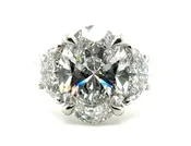 Three Stone Ring with Oval Center and Half Moon Side Diamonds