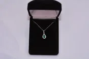 14KT White Gold Pear Emerald Pendant with Diamond Halo