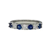 0.70 Carat Round Blue Sapphire and 0.54 Carat Round Diamond Shared Prong Band in Platinum