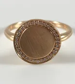 14 karat Rose gold circular ring with .09 ctw of natural round diamonds