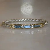 14ky/Sterling Silver Blue Topaz Closed Bangle Bracelet