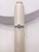 10Kt White Gold Fashion Ring Featuring a Swiss Blue Topaz and Diamonds