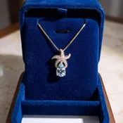 Aquamarine Starfish Pendant Necklace in Yellow Gold