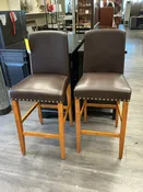 2 BROWN NAILHEAD FAUX LEATHER STOOLS