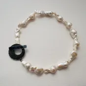 A Bold Clasp for Timeless Pearls — Your Site Title