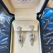 A pair of platinum and diamond drop earrings by Michael Beaudry