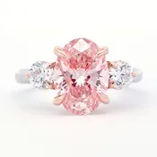 Fancy Vivid Pink 3.12 Carat Oval Diamond Three Stone Engagement Ring 3.80 CTW in 18K White & Rose Gold